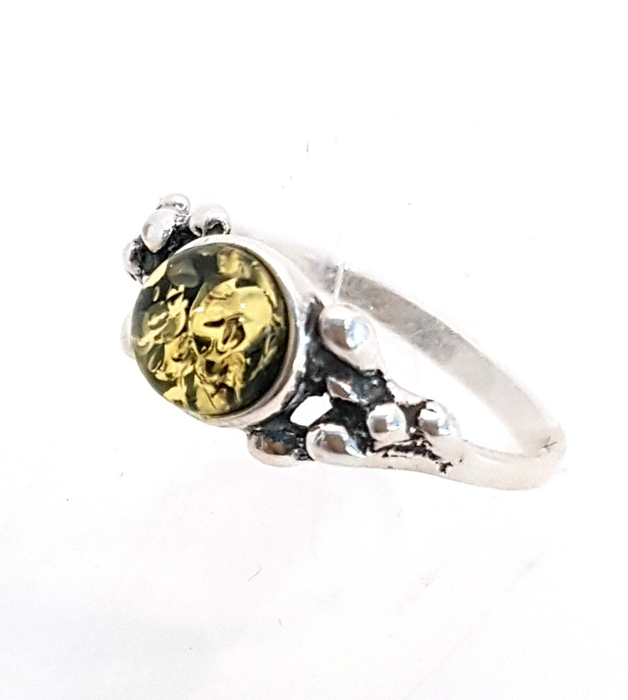 Ring with green amber with 