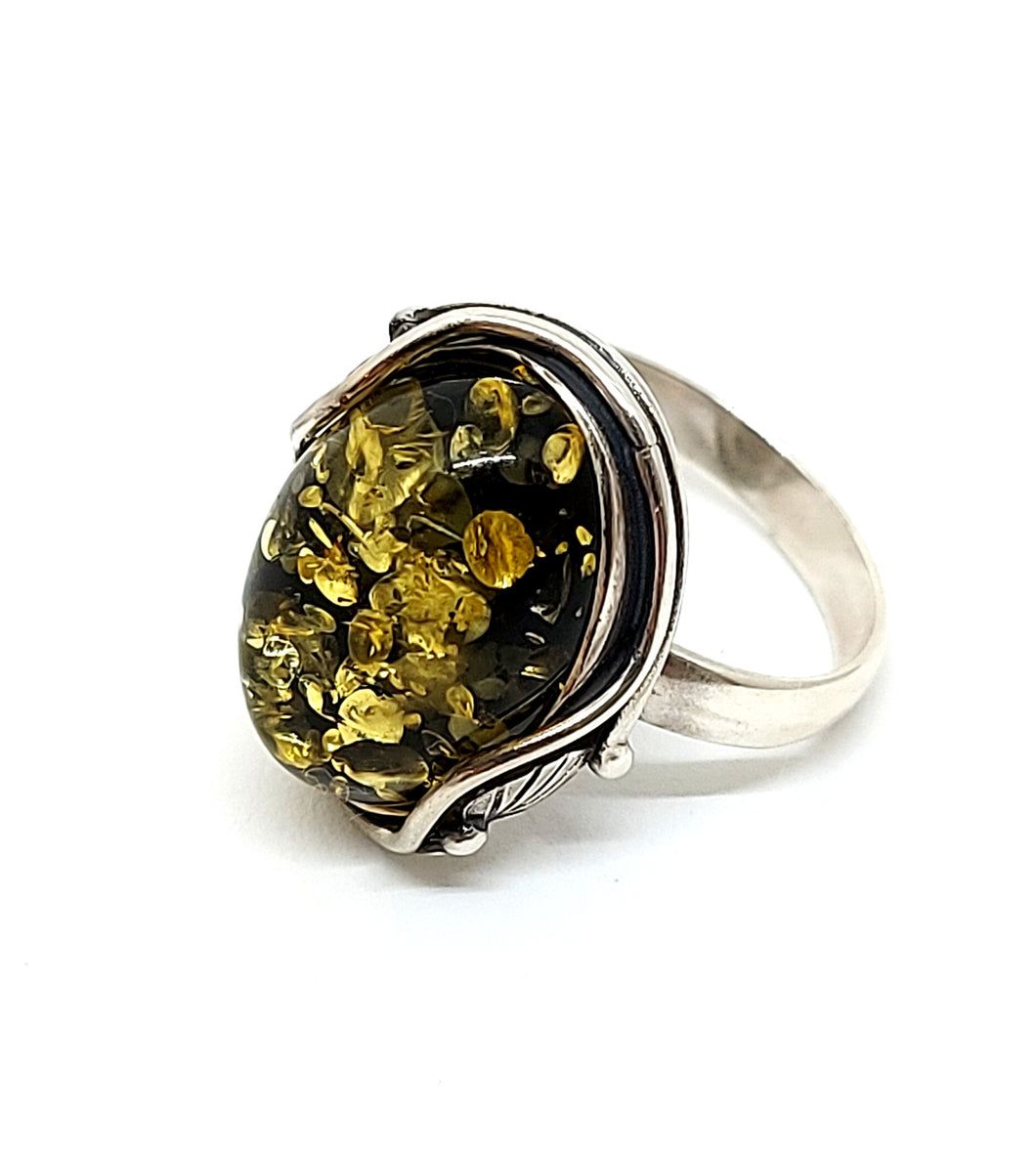 Ring with green amber 18x13.5 mm with 2 small silver leaves (925)